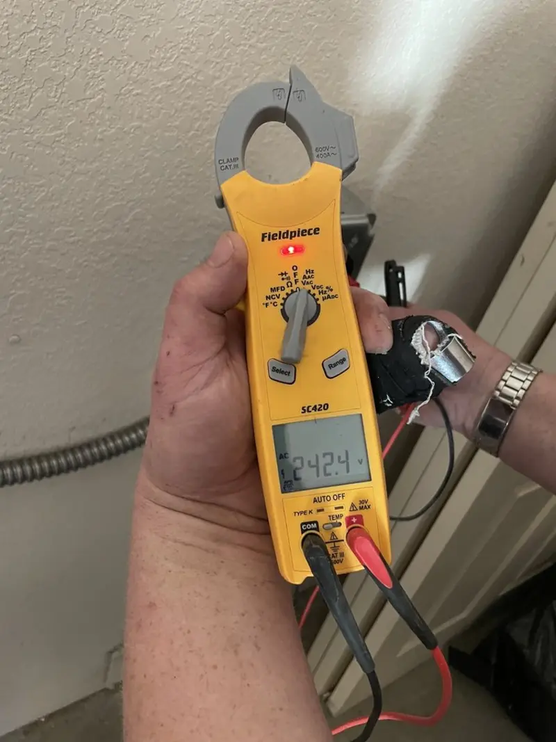 Voltage testing with clamp meter during Generator Installation in Gurnee